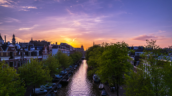 Amsterdam canal drone pov at sunset