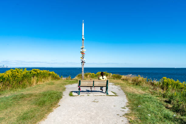 A women is enjoying the view of Lake Ontaio, Etobicoke, Canada.
