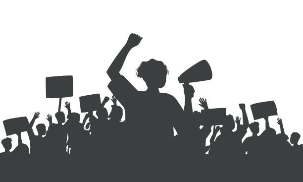 Silhouette of protesting man with loudspeaker and crowd of people with raised hands and banners Silhouette of protesting man with loudspeaker and crowd of people with raised hands and banners. Peaceful protest for human rights.Demonstration, rally, strike, revolution.Isolated vector illustration propaganda stock illustrations