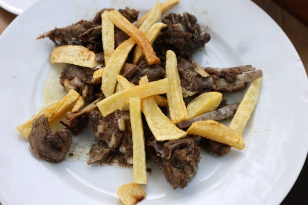 istock grilled goat with fries on a white plate 1437991024