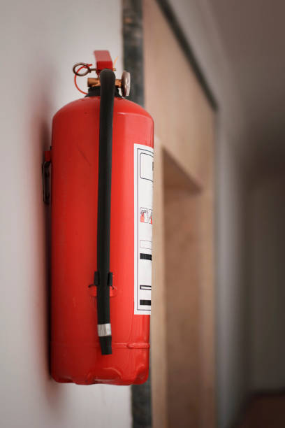 istock red fire extinguisher in apartment corridor 1437991259