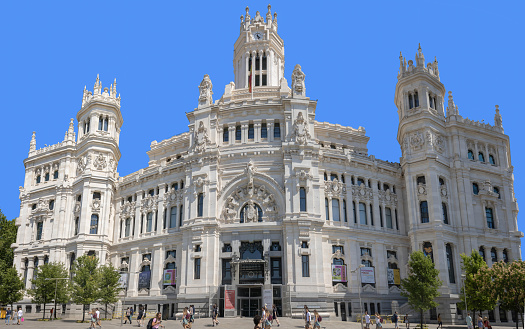 Madrid, Spain - July 9, 2022: Madrid, Spain - July 9, 2022: Cibeles Palace, formally known as Palacio de Comunicaciones and Palacio de Telecomunicaciones until 2011, is a complex composed of two buildings with white facades and is located in one of the historical centres of Madrid