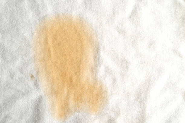 istock Coffee stain on T-shirt 1438001582