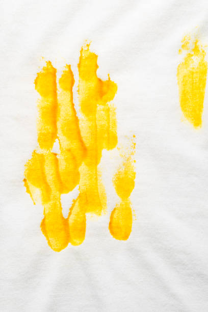 istock Mustard stain on white T-shirt 1438002548