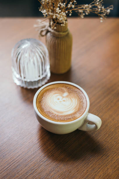 istock Halloween pumpkin latte art in coffee mug 1438002924