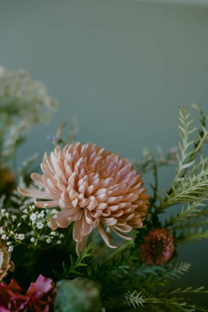 istock close up of floral arrangement with mint backdrop 1438003310