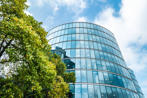 Business towers and Green leaves, London stock photo