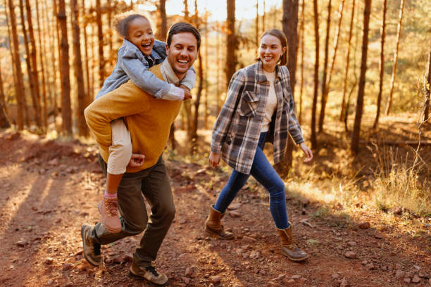 istock Young family going on a hike in the forest 1438004831