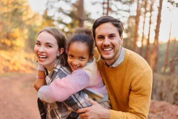 Photo of Portrait of a happy family on a hike