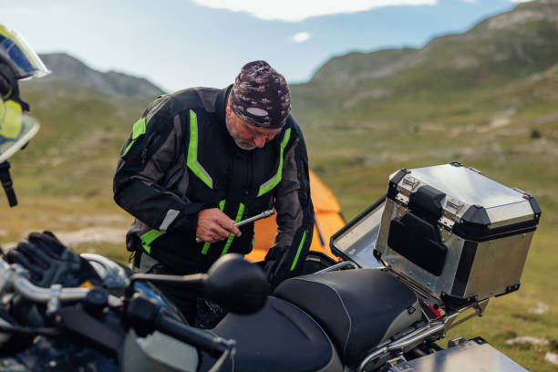istock Man is unpacking camping equipment 1438006835