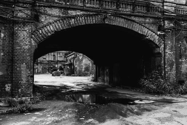istock Black white photography. Abandoned buiding. Gothic background. Scary place. Post apocalyptic landscape. Industrial background. Horror. Destruction. Conceptual bw photo. Old abandoned factory. 1438008761