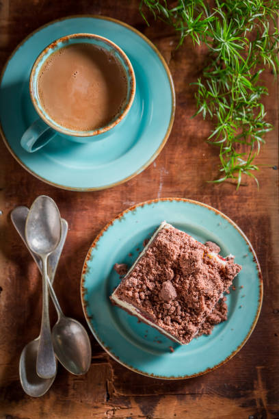 Sweet and tasty cheesecake served with coffee in blue porcelain