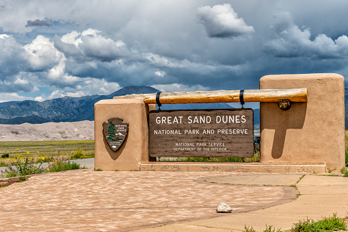 Alamosa, United States - August 19, 2022:  The National Park Service sign at the entrance to the Great Sand Dunes National Park in Colorado, United States.