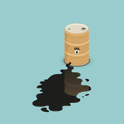 Oil barrel is lying in spilled puddle of crude oil.