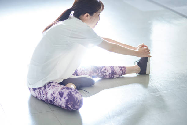 istock Young Japanese woman doing stretching 1438017548