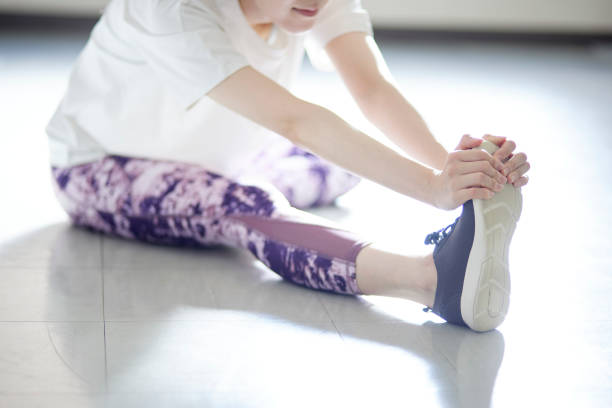 istock Young Japanese woman doing stretching 1438017552