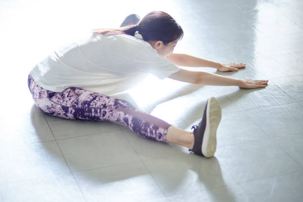 istock Young Japanese woman doing stretching 1438017554