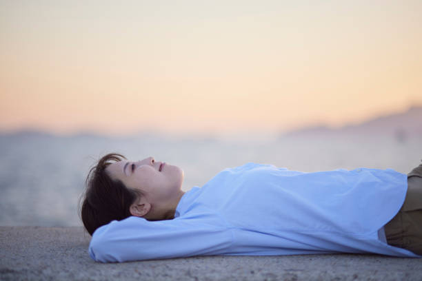 istock Sunset sea and Japanese woman 1438017764