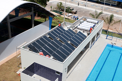 salvador, bahia, brazil - october 21, 2022: installation of solar panels on the roof of a public school in the city of salvador.