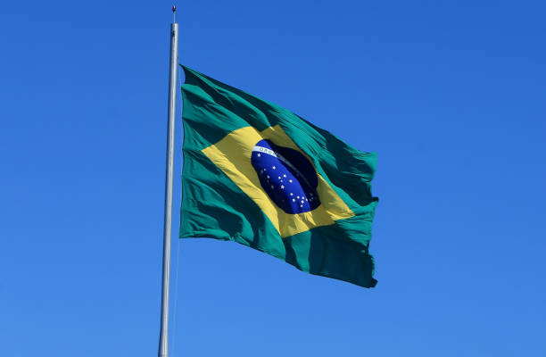 istock flag of brazil on pole 1438019028