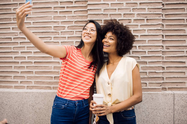 istock Two best friends on vacation in Madrid taking a selfie 1438022983