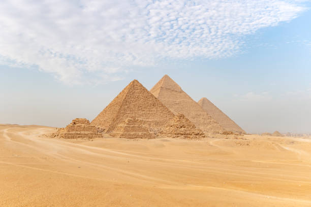 Archaeological complex of Great Egyptian Pyramids is located on the Giza plateau. Pyramids of Chephren Khafra and Cheops Khufu and Mikerina Menkaura. Cairo, Egypt. Archaeological complex of the Great Egyptian Pyramids is located on the Giza plateau. Pyramids of Chephren Khafra and Cheops Khufu and Mikerina Menkaura. Cairo, Egypt. plateau concept stock pictures, royalty-free photos & images