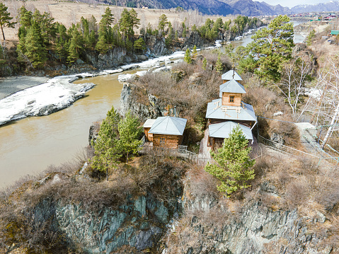 St. John the Theologian temple on the Patmos island on Katun river in Altai Mountains near Chemal village. Siberia. aerial view