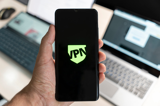 VPN - Virtual Private Network - Cyber Security and Privacy Data Encryption Software Solutions for Business concept. smartphone with vpn app for anonymous internet using, unblock websites