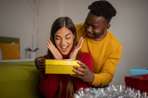 istock Couple celebrating winter holidays 1438023681