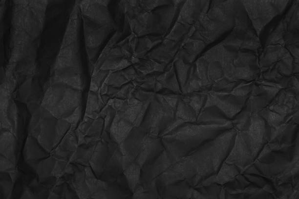 istock black crumpled paper texture as background 1438031174