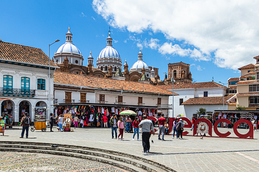 Cuenca, Ecuador - August 12, 2022: San Francisco Plaza (square) in historical center of city Cuenca, UNESCO world heritage site, city name sign \