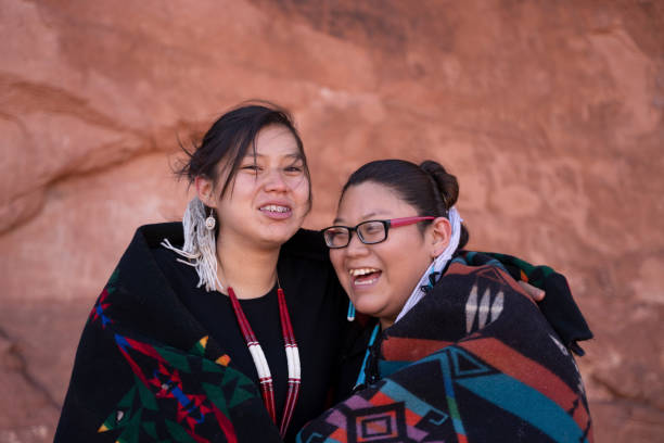 istock Navajo sisters embracing in Monument Valley 1438032323