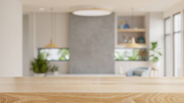 mesa de madera vacía con vista borrosa de la sala de estar escandinava. - living will fotografías e imágenes de stock