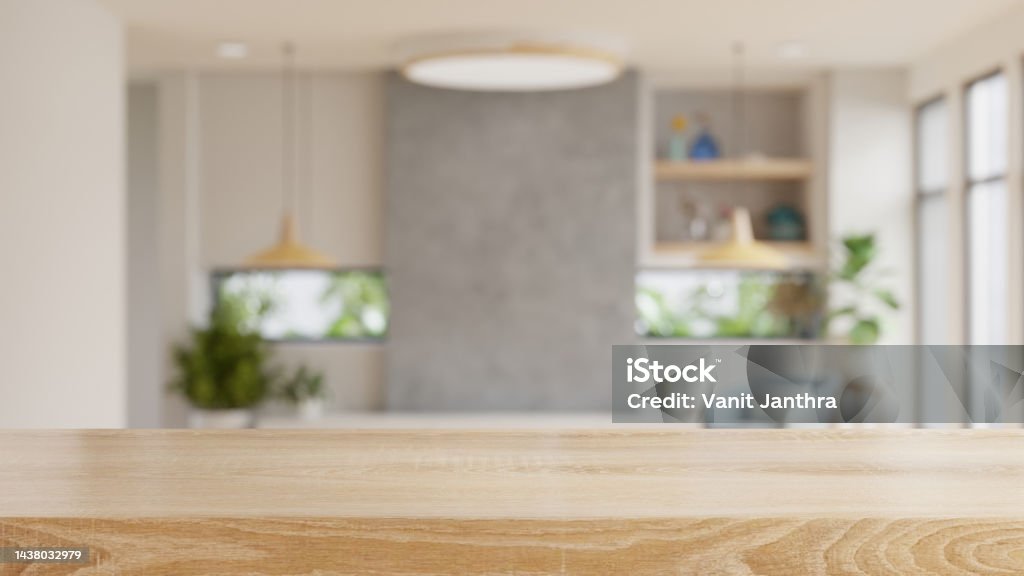 Empty wooden table with blurred view of scandinavian living room. Empty wooden table with blurred view of scandinavian living room.3d rendering Table Stock Photo