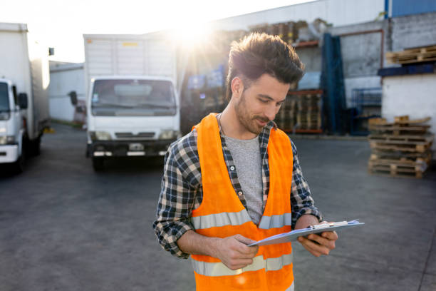 istock Truck driver checking his route before driving to his next destination 1438034479