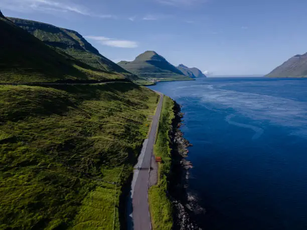 Beautiful aerial view of Sydradalur port and village near the Seal woman statue in the Faroe Islands