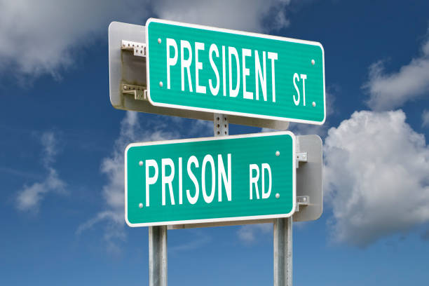 istock President Street, Prison Road Intersection Sign Representing Political Corruption 1438038325