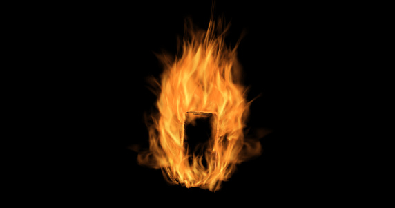 Smartphone burning on black background.