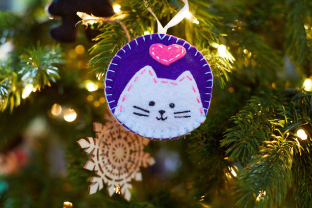 istock A hand-made felt ornament with a cat on a Christmas tree 1438040863