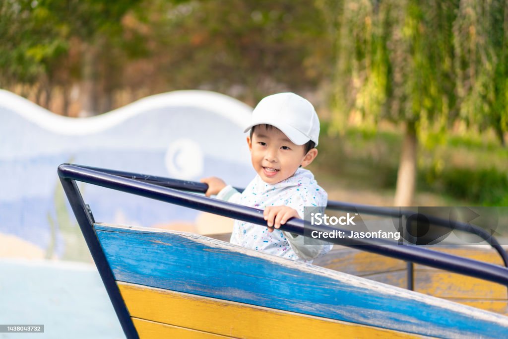 A Chinese baby A baby playing in the park Amusement Park Stock Photo