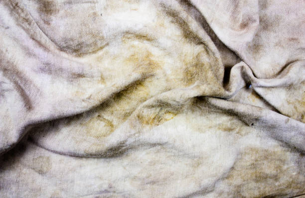 The dirty greasy fabric, matter. Fabric stained texture. Contaminated textile or canvas