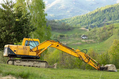 Heavy machinery against rural landscape