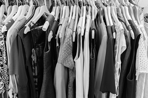 Old clothes hanging in the cloakroom, women's clothing