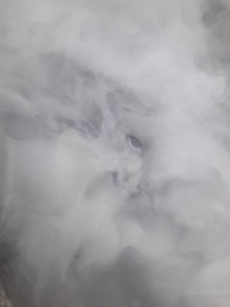 istock Blurry white mist or smoke or steam on black background 1438063141
