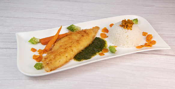 Recipe for Hake fillet breaded with panko, rice, carrot chips and coriander sauce. High quality video