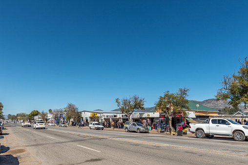 Citrusdal, South Africa - Sep 9, 2022: A street scene, with businesses, people and vehicles, in Citrusdal in the Western Cape Province
