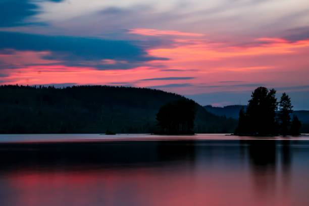 istock Dramatic view of sunset over a lake in long exposure 1438064408