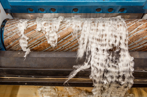 Cotton carding machine. Detail of Carding area. . High quality photo