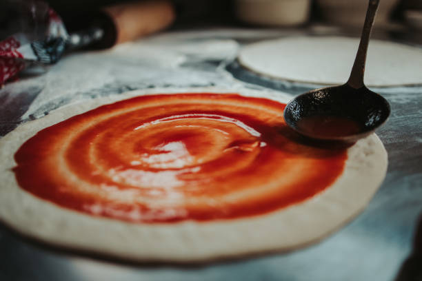 istock Closeup shot of the process of making pizza 1438065000
