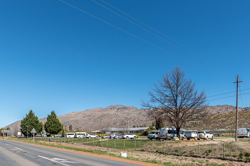 Op Die Berg, South Africa - Sep 9, 2022: The primary school Koue Bokkeveld in Op Die Berg in  the Western Cape Province. Many vehicles are visible